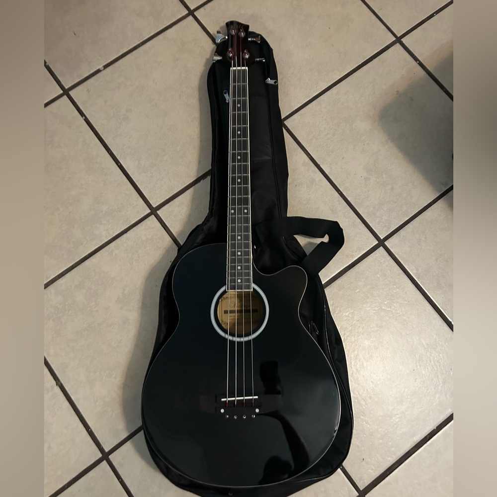 I am selling this YMC acoustic bass guitar. Brand new, never used.